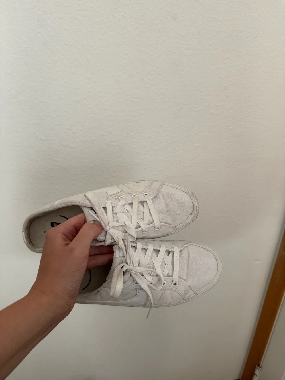 Nike Women’s White Canvas slip-on Sneakers
